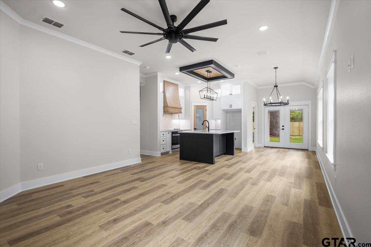 3022 West Rose Street Tyler, TX 75701 - Photo 9 of 46 a view of a kitchen with a sink and a refrigerator