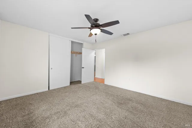 a view of a ceiling fan in a room