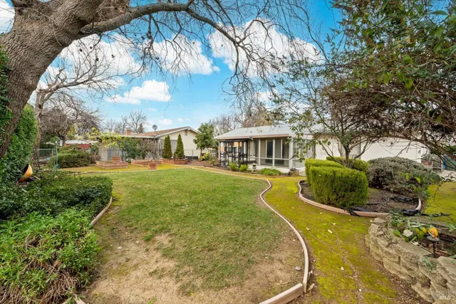 a view of a swimming pool with a yard