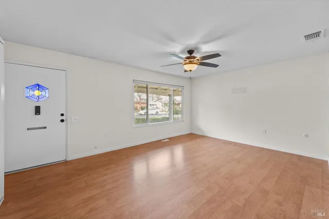 a view of an empty room with a window
