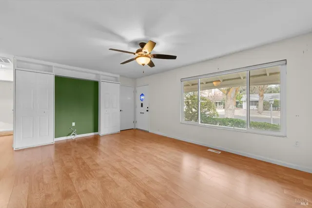 a view of an empty room with a window