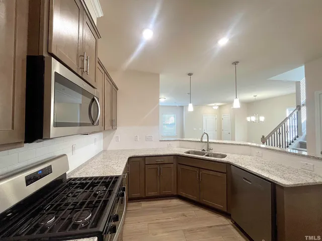 a kitchen with a sink and stove