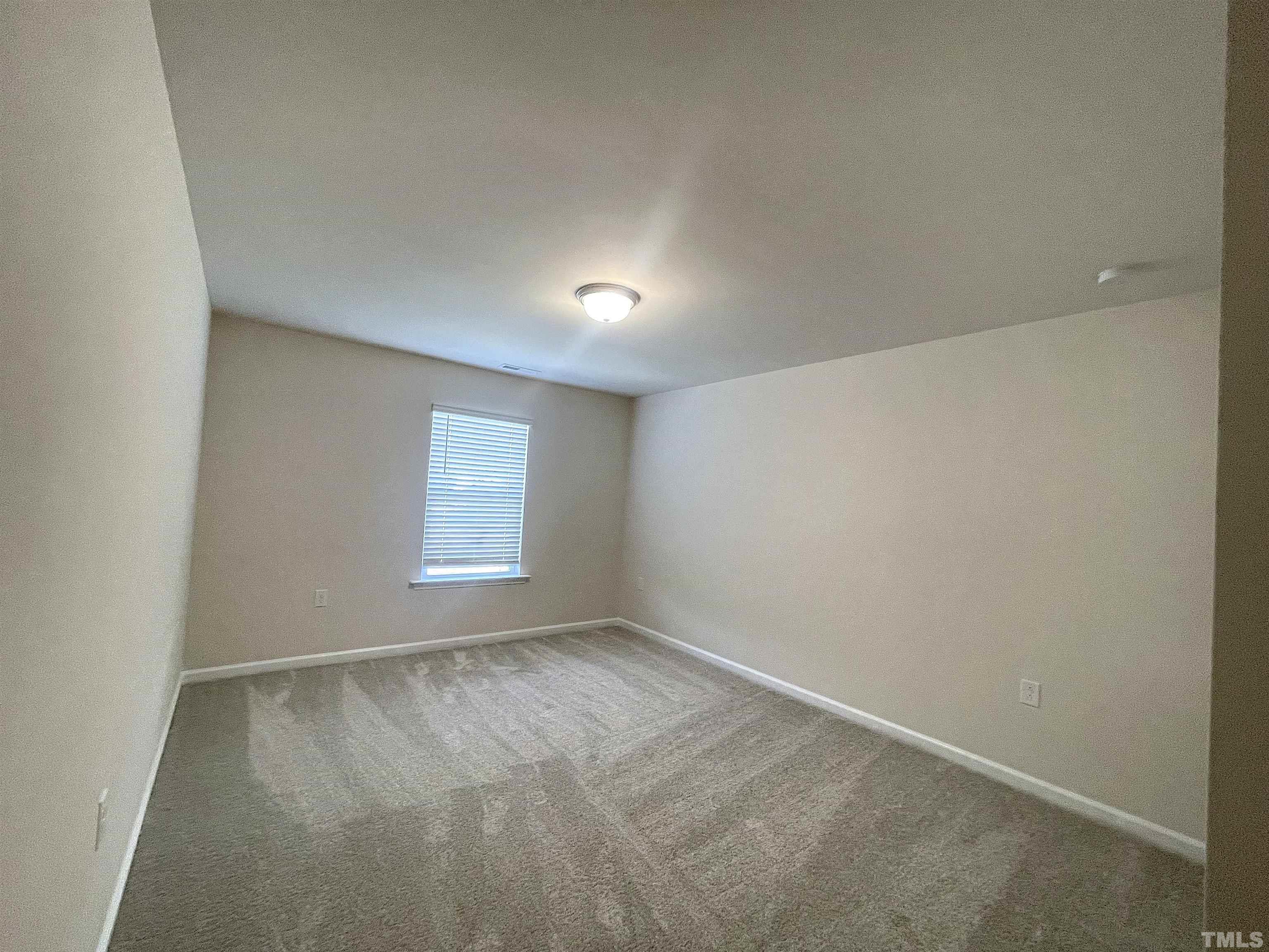 4906 Megara Run Raleigh, NC 27603 - Photo 13 of 30 an empty room with a window