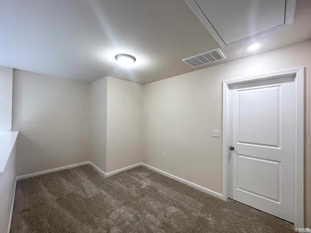 an empty room with an entryway