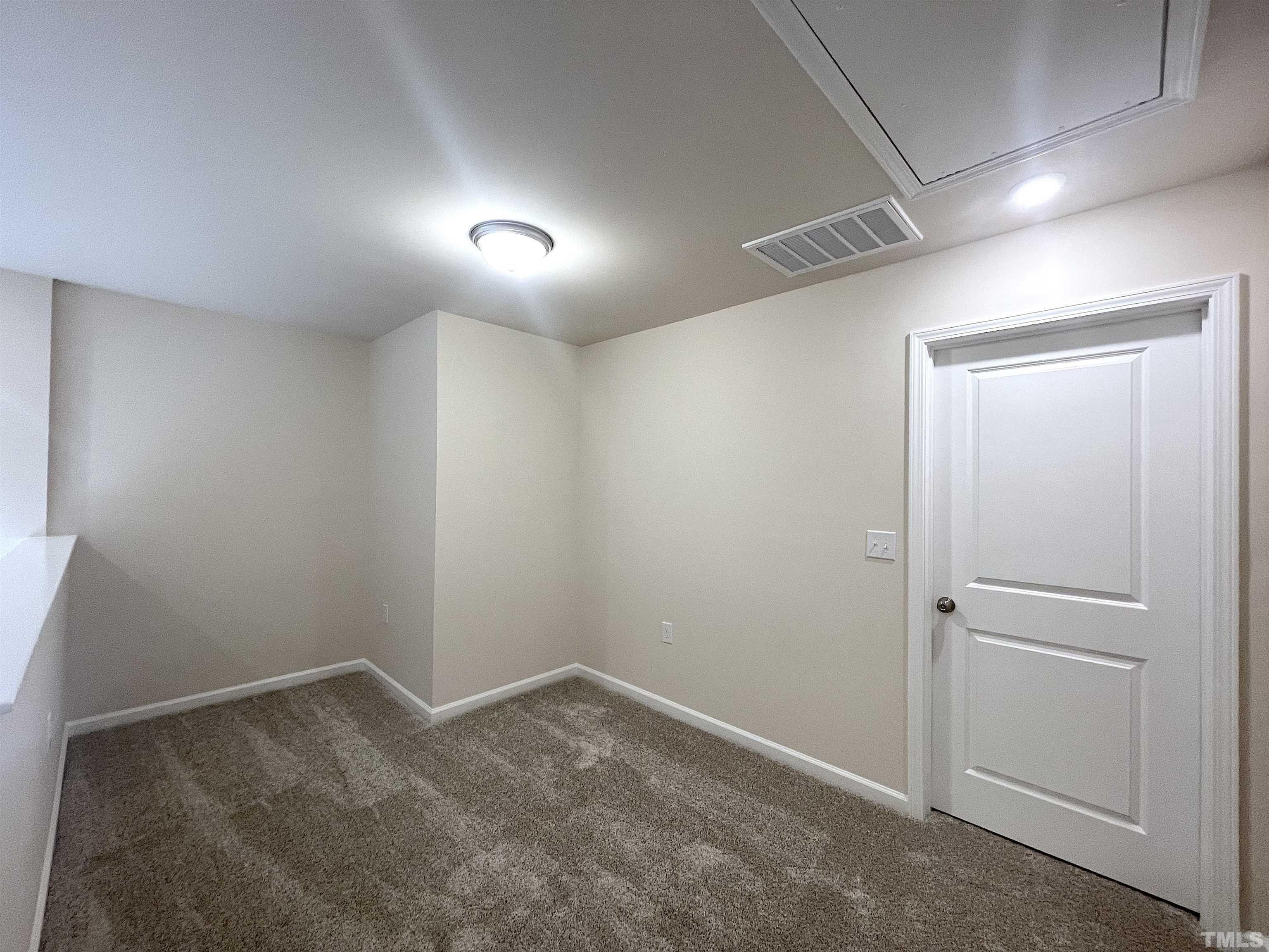 4906 Megara Run Raleigh, NC 27603 - Photo 20 of 30 an empty room with an entryway