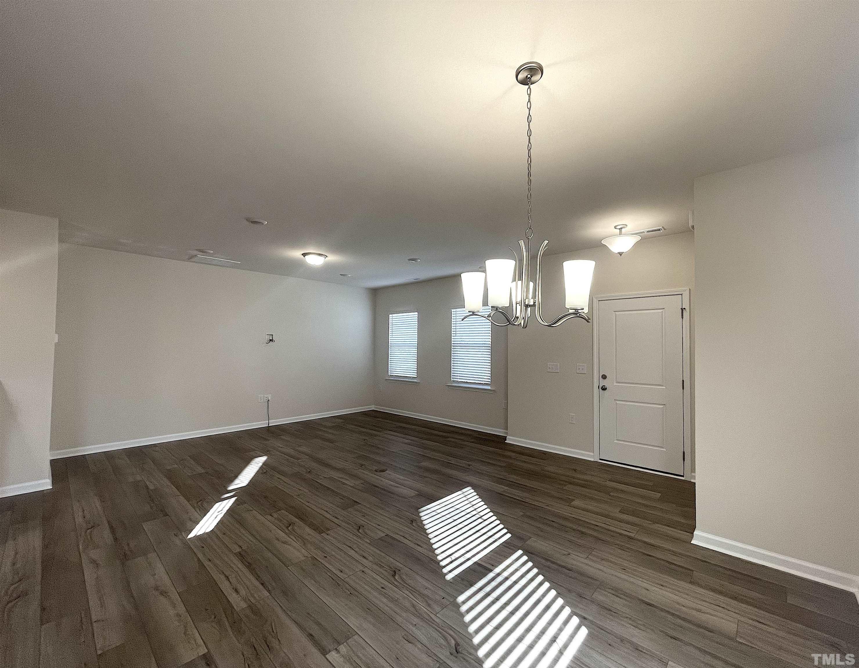4906 Megara Run Raleigh, NC 27603 - Photo 2 of 30 a view of a room with wooden floor and windows