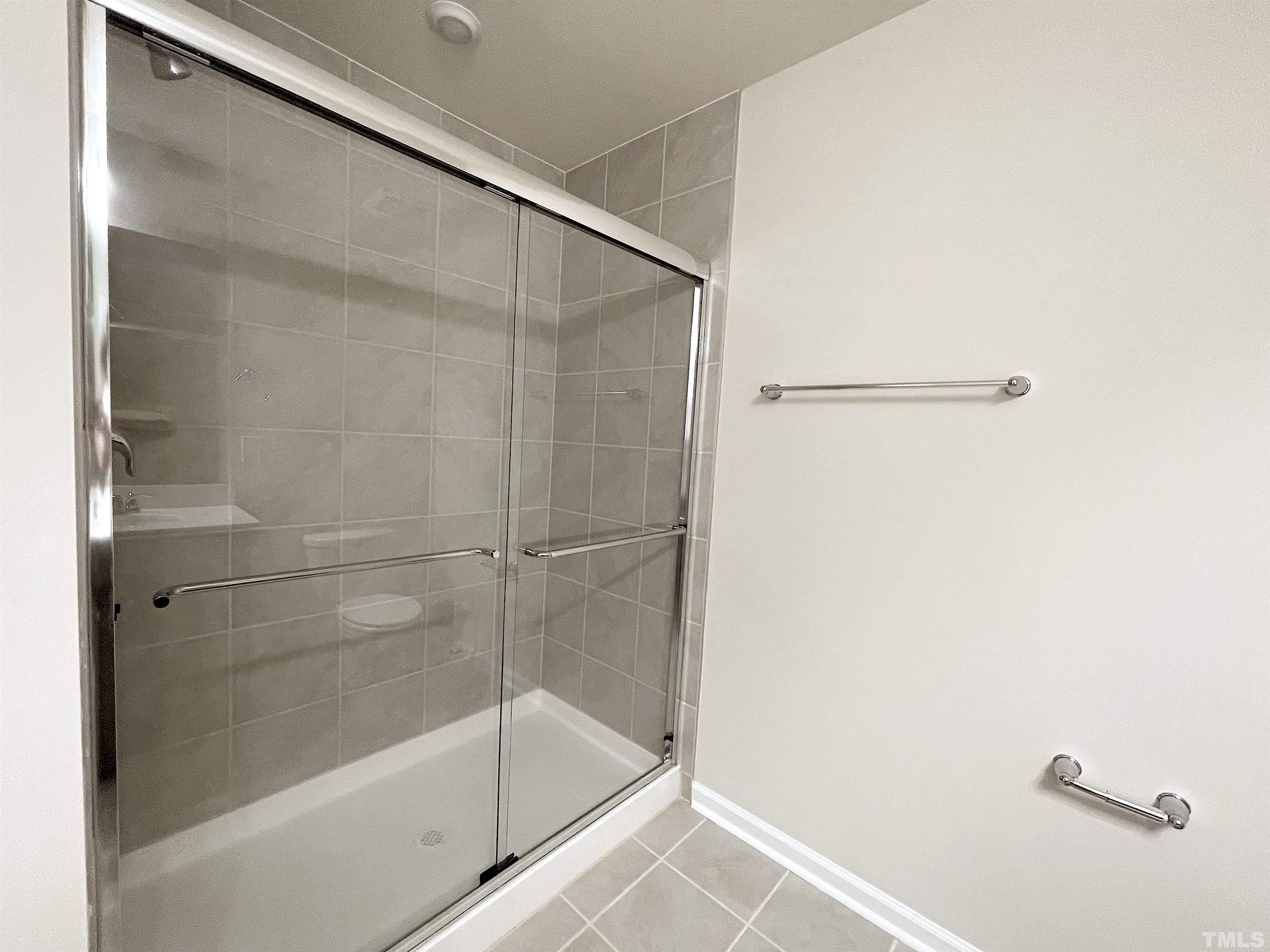 4906 Megara Run Raleigh, NC 27603 - Photo 23 of 30 a bathroom with a bathtub