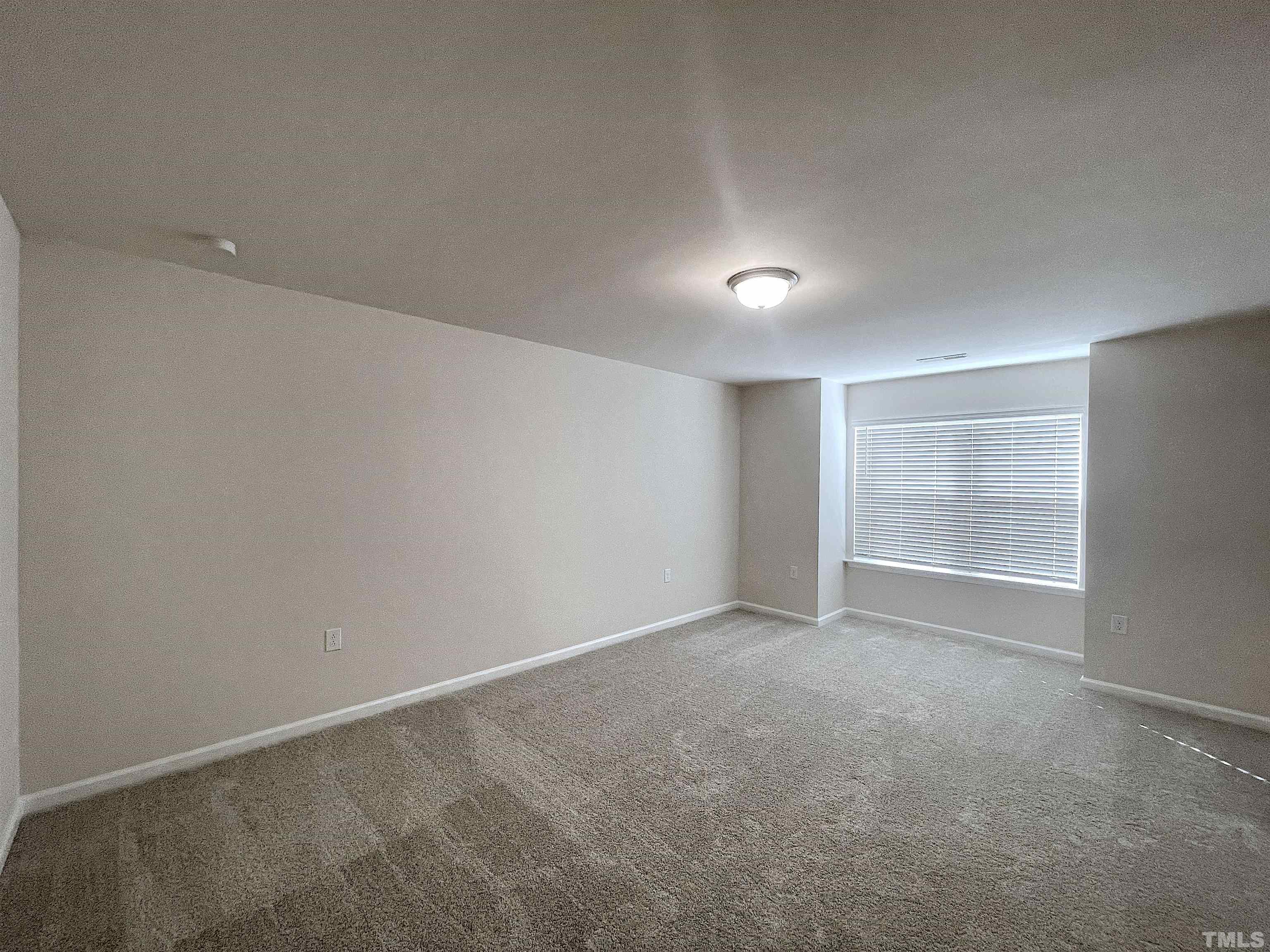4906 Megara Run Raleigh, NC 27603 - Photo 24 of 30 a view of an empty room with a window