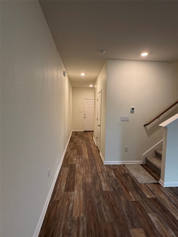 364 Bell Rings Drive Jarrell, TX 76537 - Photo 12 of 25 Corridor featuring stairway, dark wood-style flooring, and recessed lighting