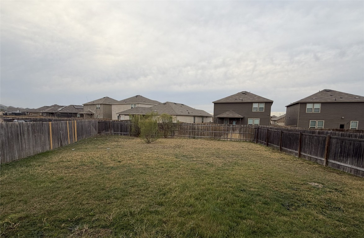 364 Bell Rings Drive Jarrell, TX 76537 - Photo 14 of 25 Fenced backyard. One side is a dedicated vacant lot