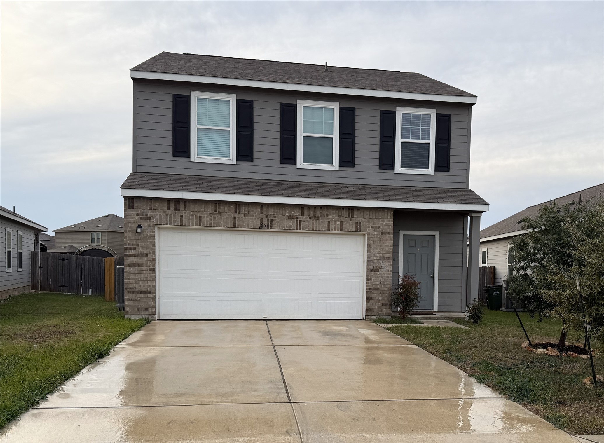 364 Bell Rings Drive Jarrell, TX 76537 - Photo 3 of 25 a front view of a house with a yard and garage