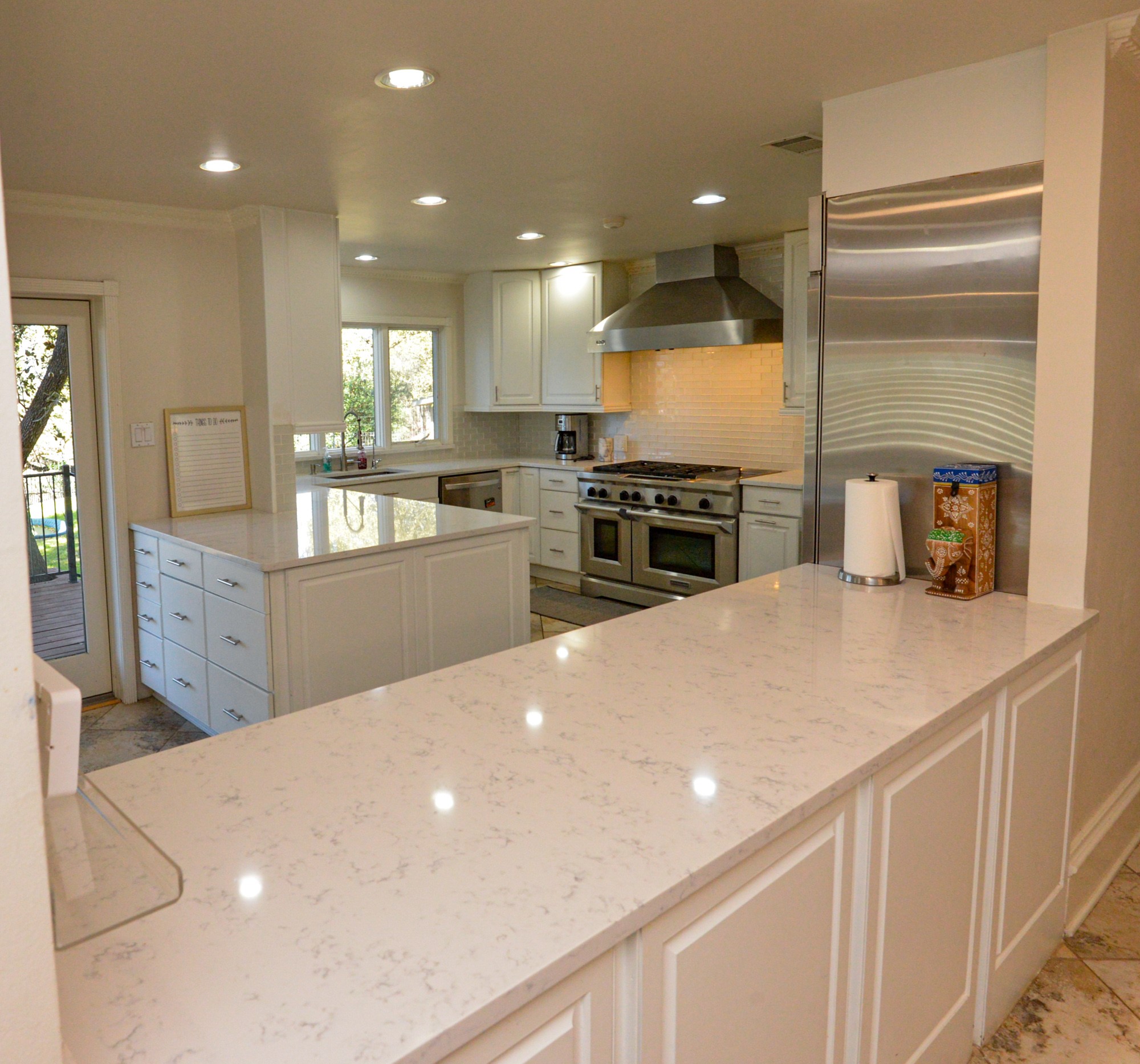 10710 D-K Ranch Road Austin, TX 78759 - Photo 11 of 34 Culinary delights await in this bright kitchen with a spacious island and gleaming counters.