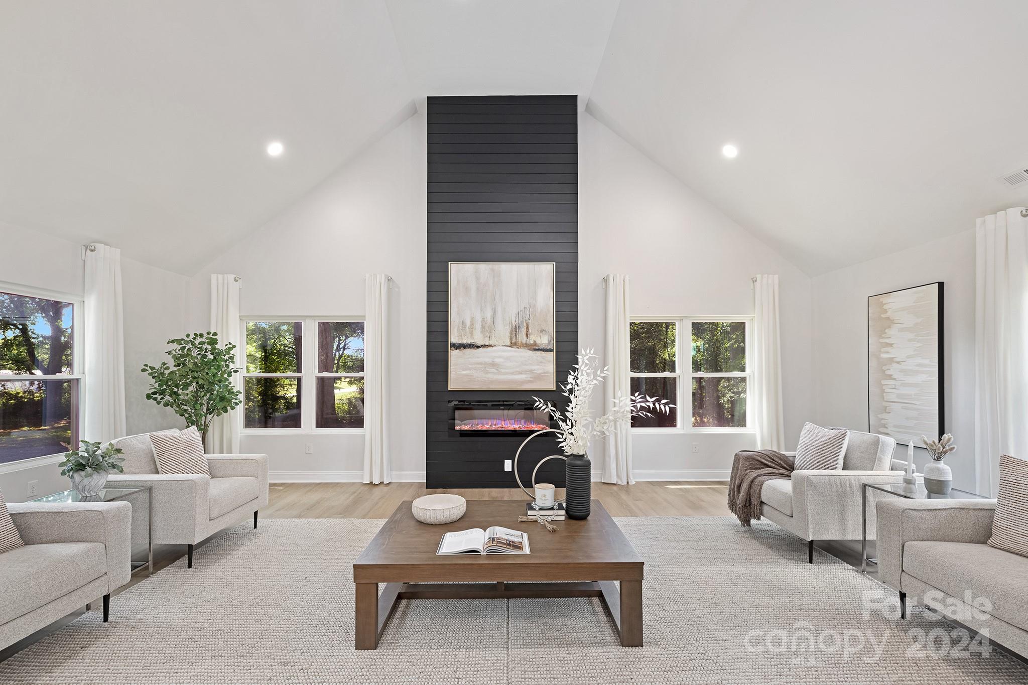 1234 Midway Road Statesville, NC 28625 - Photo 1 of 25 a living room with furniture couches and a large window