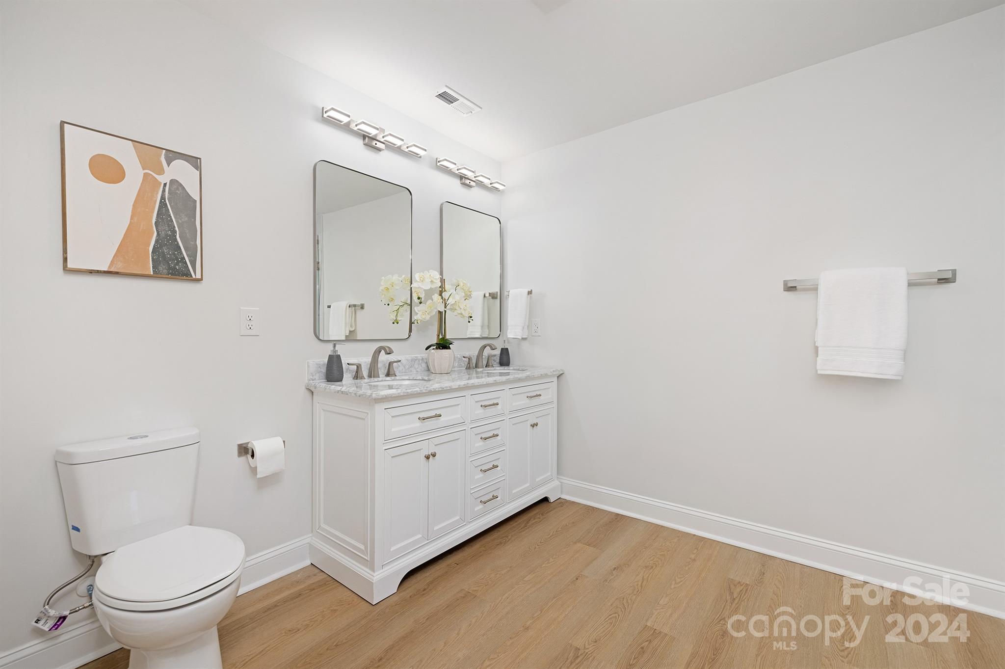 1234 Midway Road Statesville, NC 28625 - Photo 15 of 25 a bathroom with a sink mirror vanity and toilet