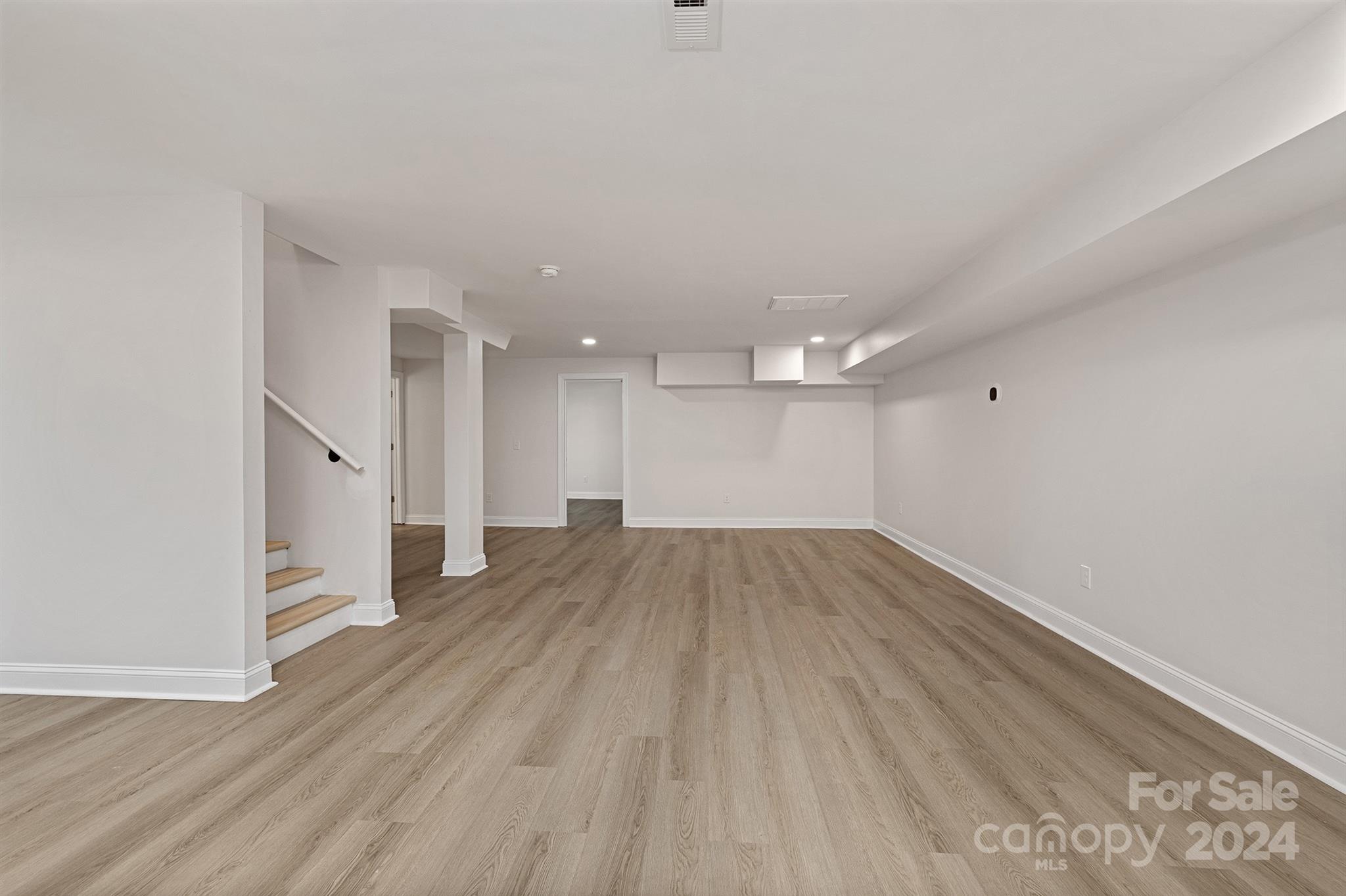 1234 Midway Road Statesville, NC 28625 - Photo 16 of 25 wooden floor in an empty room with a window