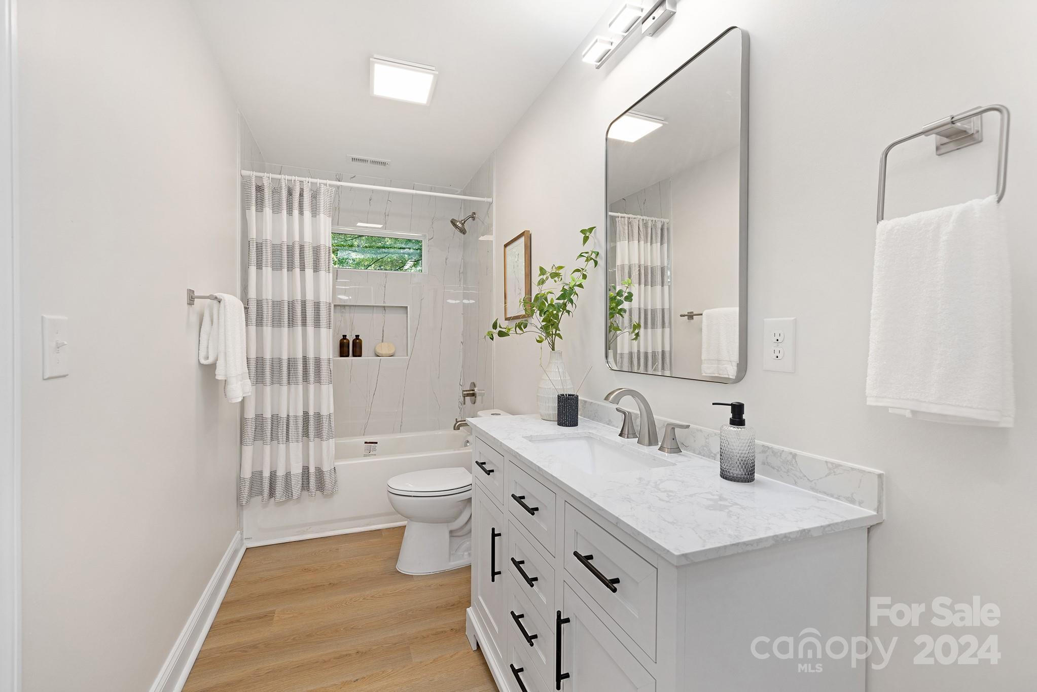 1234 Midway Road Statesville, NC 28625 - Photo 21 of 25 a bathroom with a sink a toilet and shower