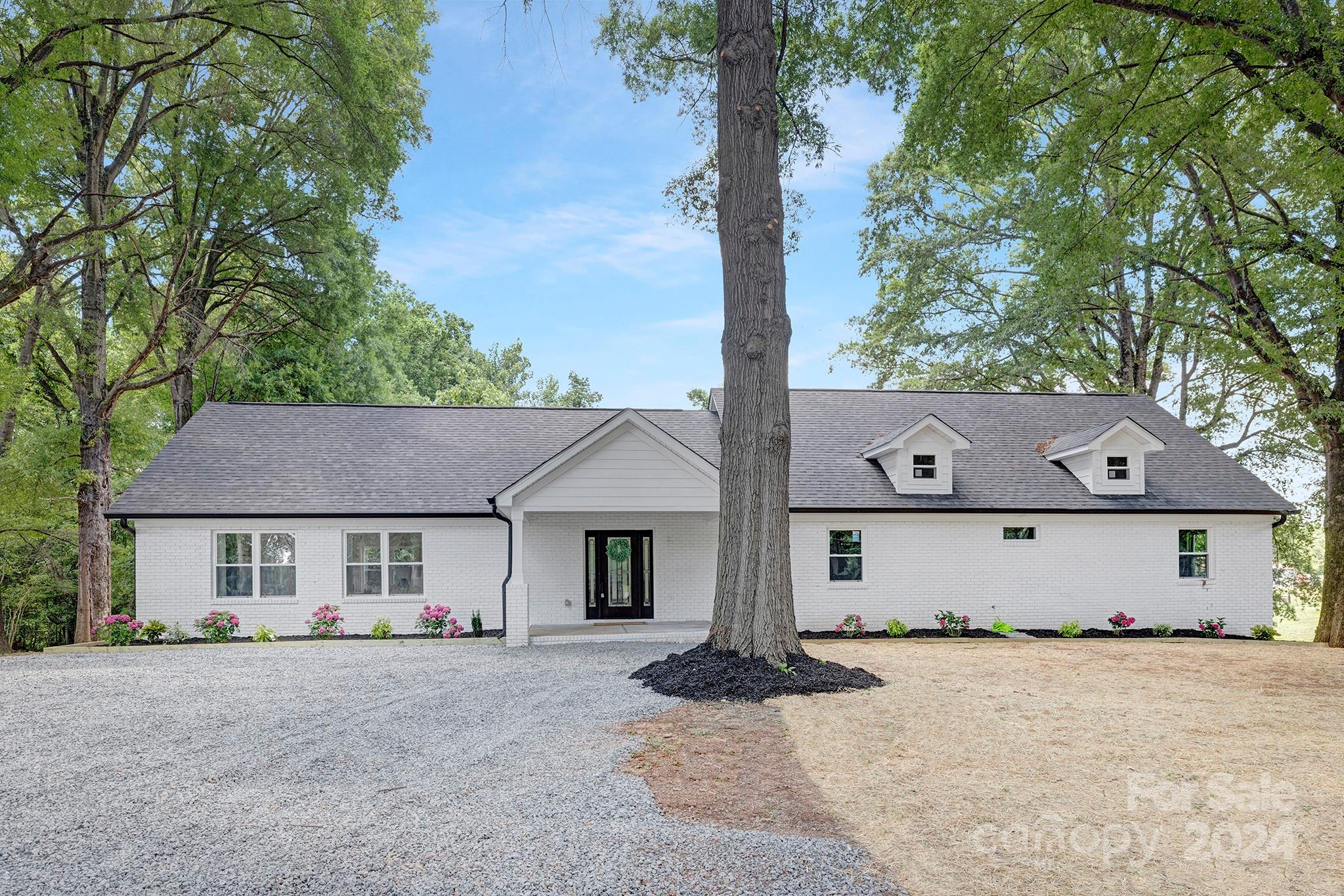 1234 Midway Road Statesville, NC 28625 - Photo 24 of 25 a front view of a house with a yard and garage