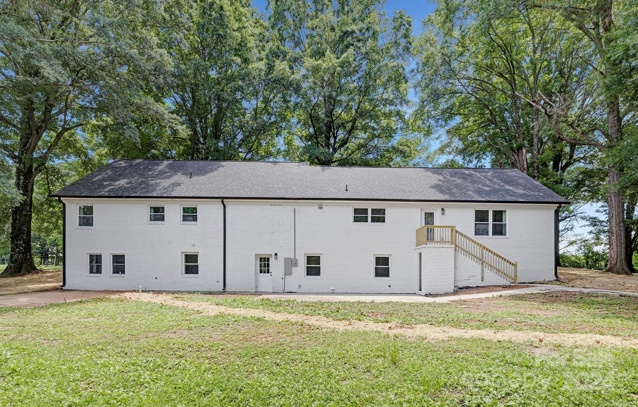 1234 Midway Road Statesville, NC 28625 - Photo 25 of 25 a view of a house with backyard and garage