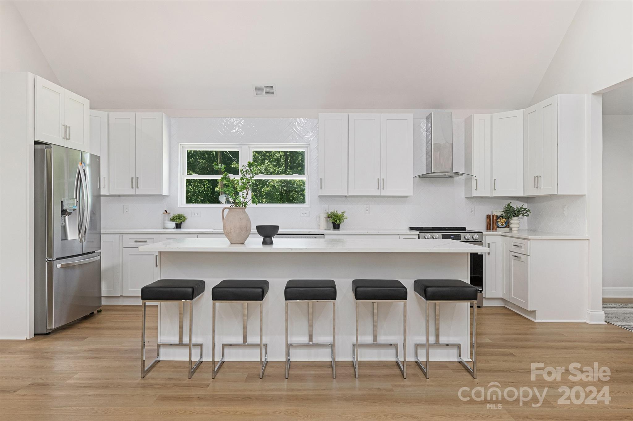 1234 Midway Road Statesville, NC 28625 - Photo 7 of 25 a kitchen with stainless steel appliances a table and chairs in it