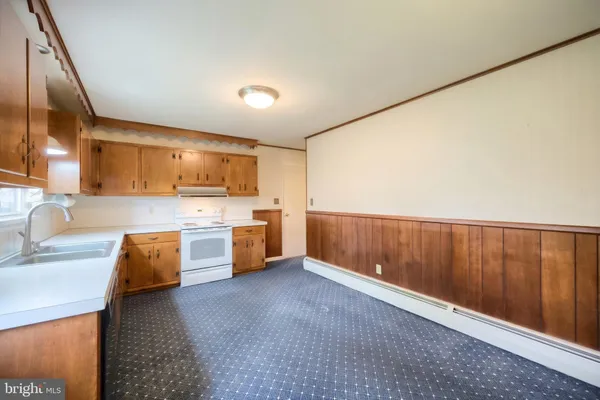 a large kitchen with a large window