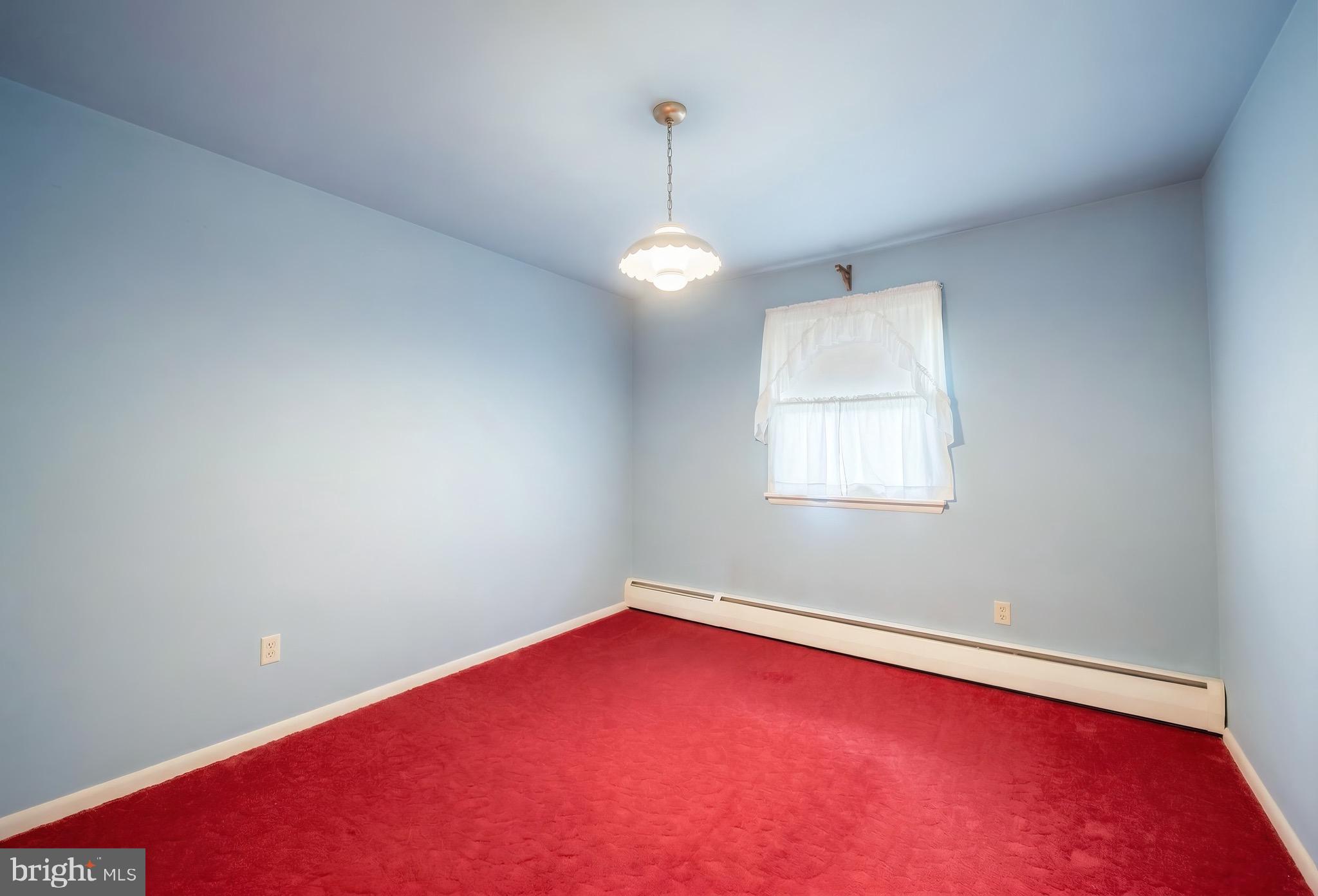 145 Mt Tabor Road Aspers, PA 17304 - Photo 19 of 40 an empty room with chandelier fan and windows
