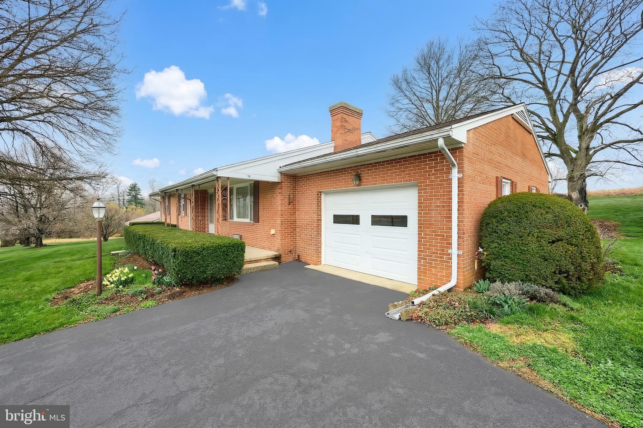 145 Mt Tabor Road Aspers, PA 17304 - Photo 2 of 40 a view of a house with a yard and garage
