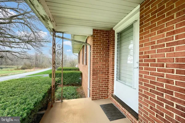 a view of a door and a window
