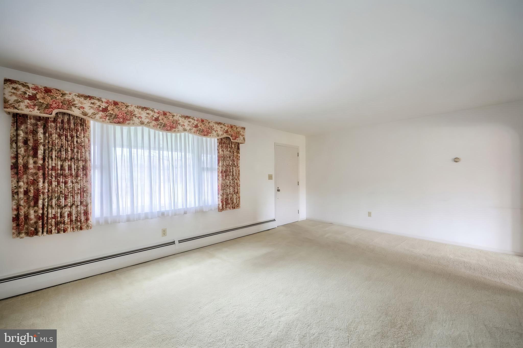 145 Mt Tabor Road Aspers, PA 17304 - Photo 9 of 40 an empty room with a empty space and windows