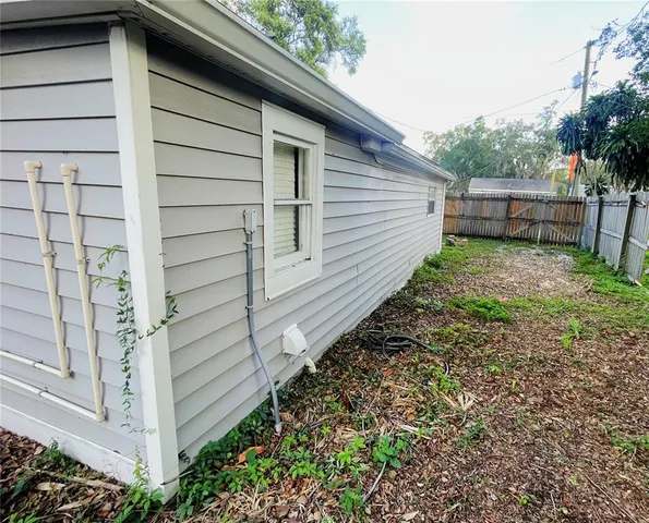 a view of a back yard of the house