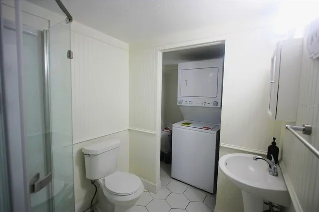 a bathroom with a sink toilet and vanity