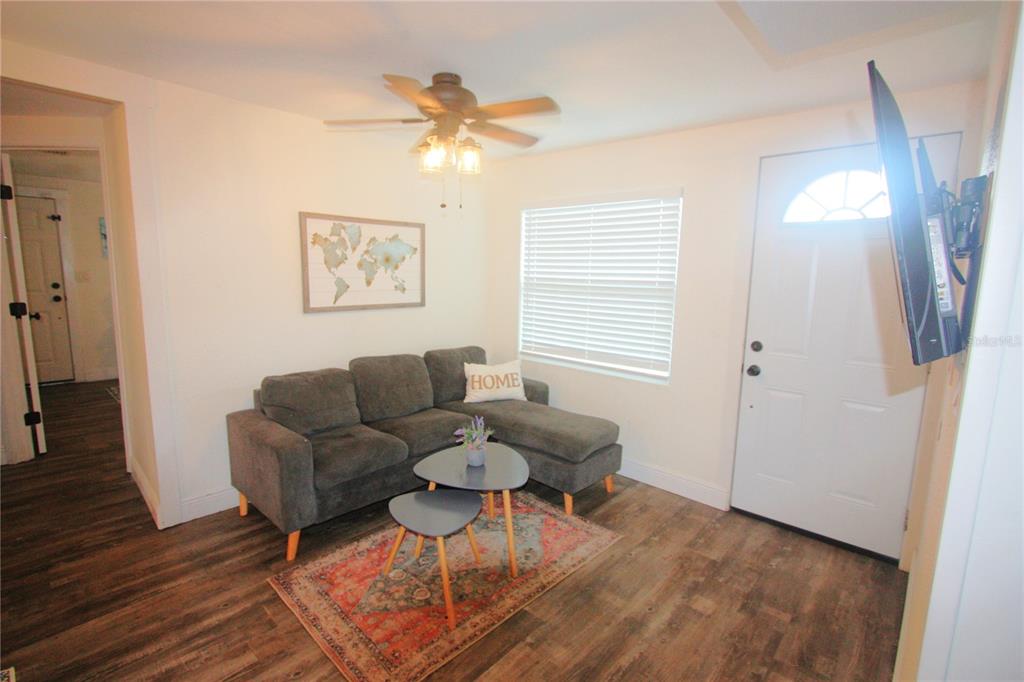 6602 North 9th Street Tampa, FL 33604 - Photo 8 of 22 a living room with furniture and a window