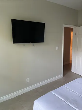 an empty room with wooden floor