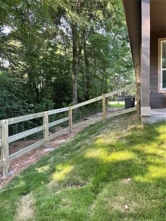 a view of a backyard with swimming pool