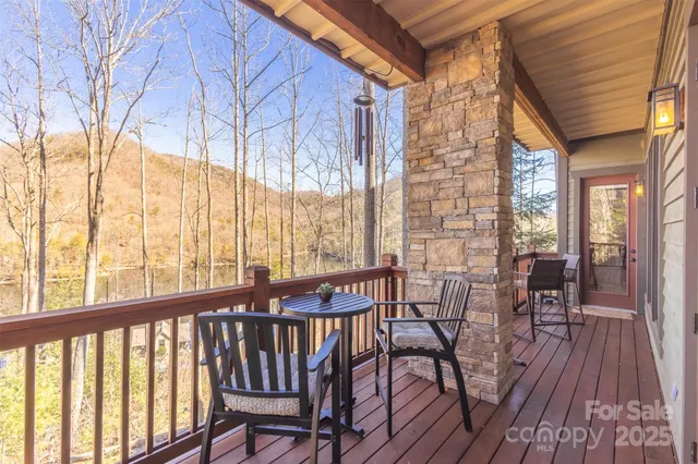 a view of a balcony with chairs