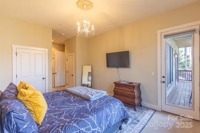 a bedroom with a bed and a lamp