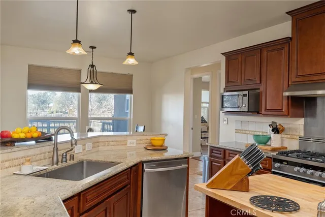a view of a kitchen with appliances and cabinets