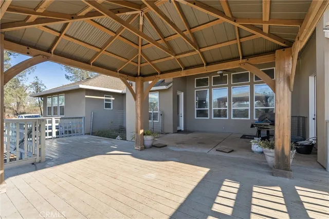 an aerial view of a house with a yard basket ball court