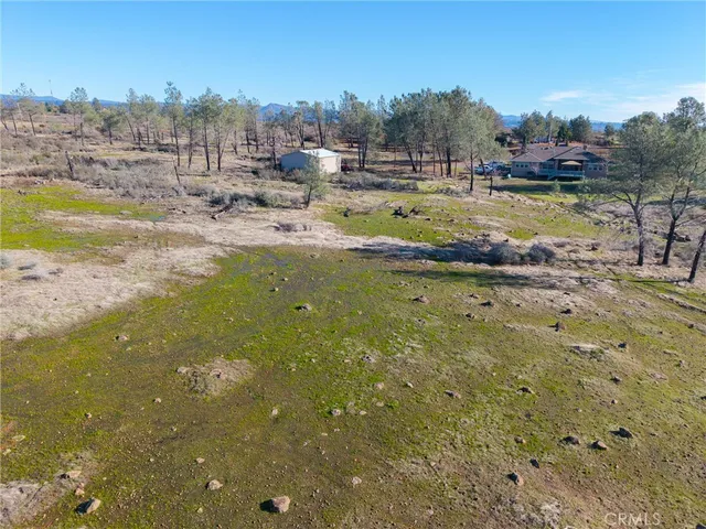 a view of swimming pool with a table and chairs