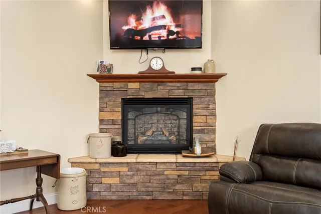 a dining room with furniture a chandelier and window