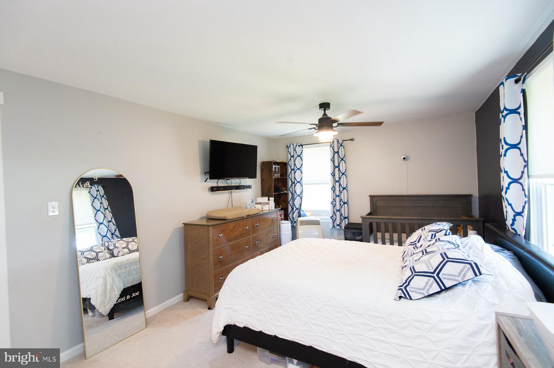 12 North Maple Avenue Ridgely, MD 21660 - Photo 20 of 30 a bedroom with a bed and a flat screen tv