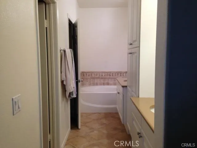 a bathroom with a tub and shower