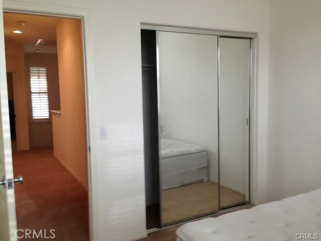 a bathroom that has a glass door and shower