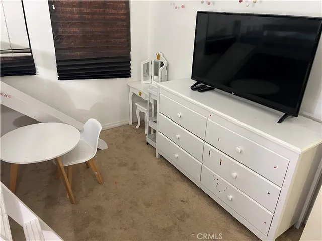 a bathroom with a sink a mirror and a toilet