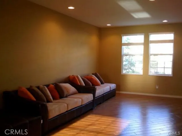 a living room with a couch and a large window
