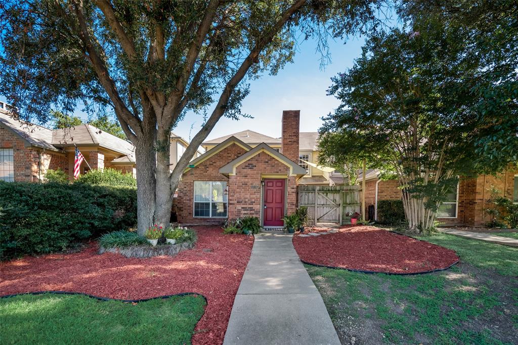 1734 East Peters Colony Road Carrollton, TX 75007 - Photo 1 of 1 a front view of a house with yard and green space