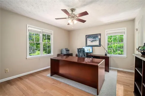 a work room with furniture and a window