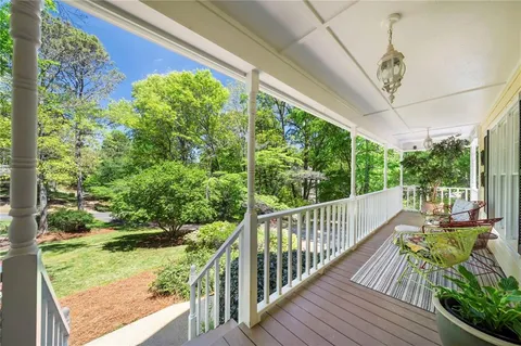 a view of a balcony with chairs