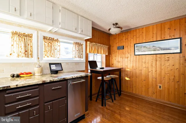 a kitchen with stainless steel appliances and wooden cabinets
