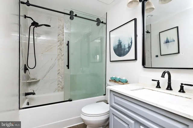 a view of a patio with table and chairs potted plants and large tree