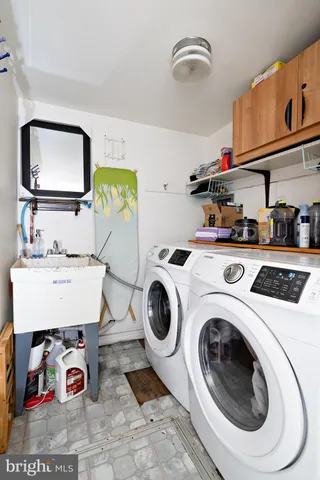 a view of a backyard with a patio and a fire pit